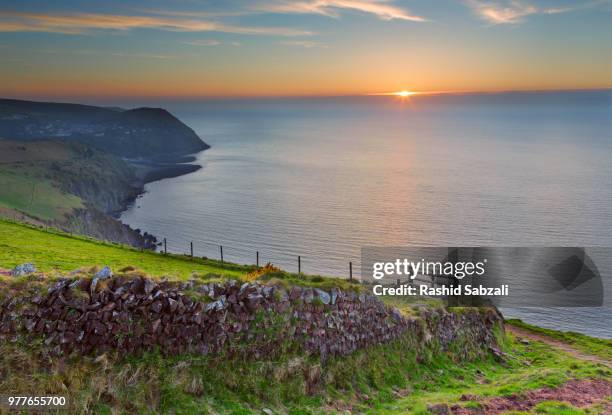 countisbury hill at sunset, lynton, devon, england, uk - lynton devon stock pictures, royalty-free photos & images