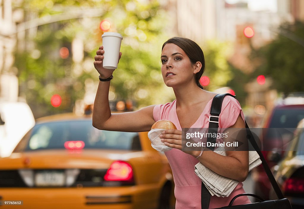 Woman hailing cab