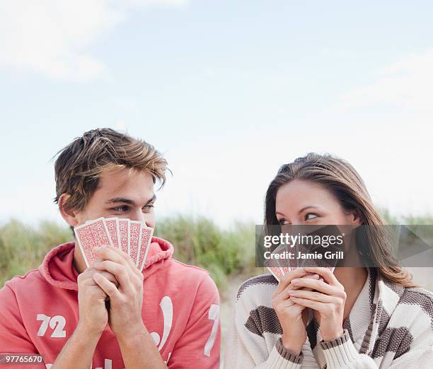 couple playing cards - dating game stock pictures, royalty-free photos & images