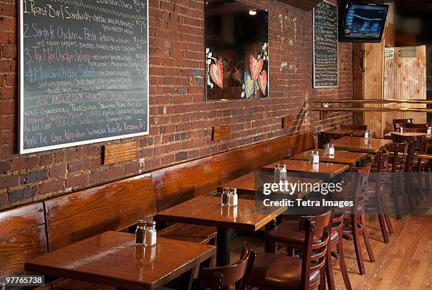 tables in restaurant - bar wall stock pictures, royalty-free photos & images