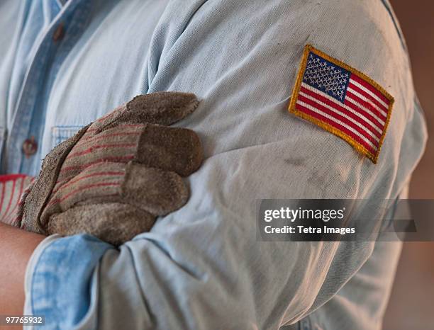 blue collar working wearing american flag patch - work with us fotografías e imágenes de stock
