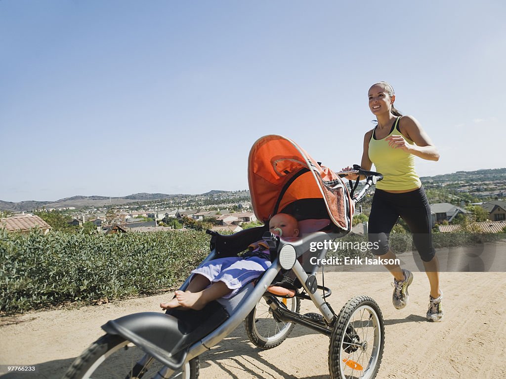 Woman jogging with stroller