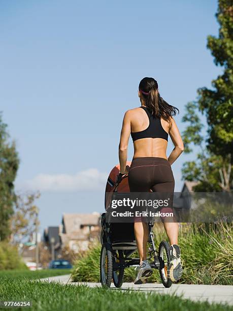 jogger and baby - jogging stroller stockfoto's en -beelden