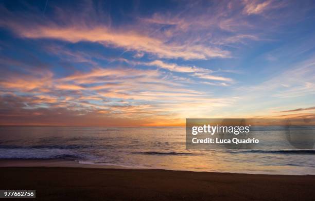 sunrise at barceloneta beach - barceloneta beach stock pictures, royalty-free photos & images