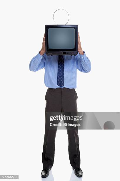 man holding television in front of face - person with in front of screen stockfoto's en -beelden