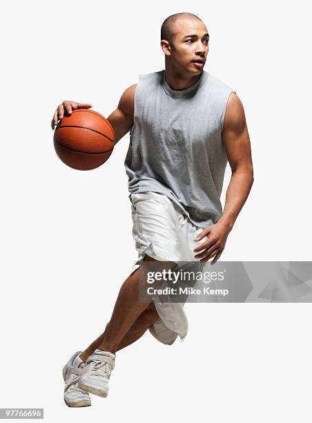 basketball player dribbling - basketball player stock-fotos und bilder