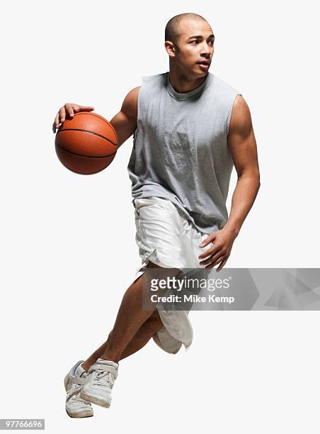 basketball player dribbling - dribbling sport fotografías e imágenes de stock