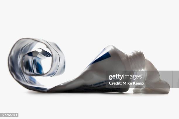half empty toothpaste tube spilling - toothpaste spill stock pictures, royalty-free photos & images