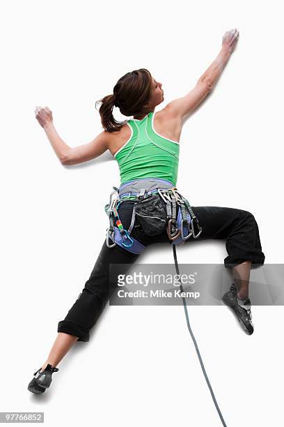 studio shot of a woman climber - freeclimber stock-fotos und bilder