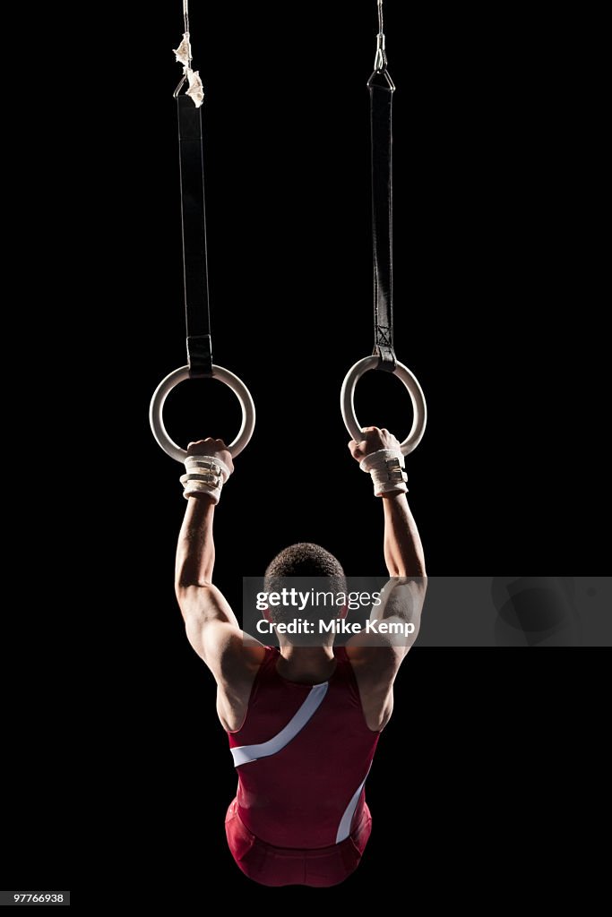 Gymnast swinging from rings