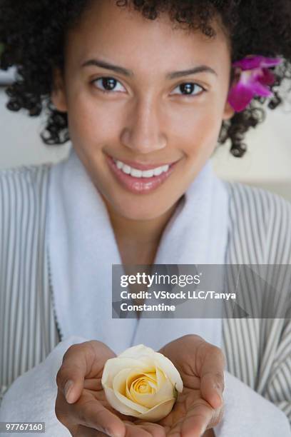 woman in robe holding flower - robe rose stock pictures, royalty-free photos & images