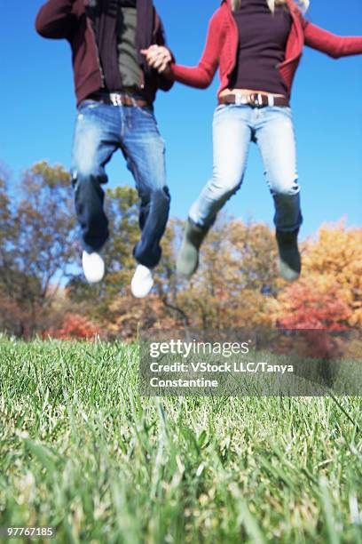 couple jumping - fairfax california stockfoto's en -beelden