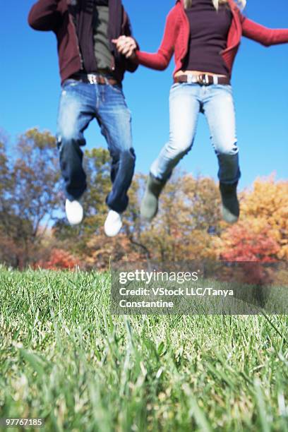 couple jumping - fairfax - california stock pictures, royalty-free photos & images