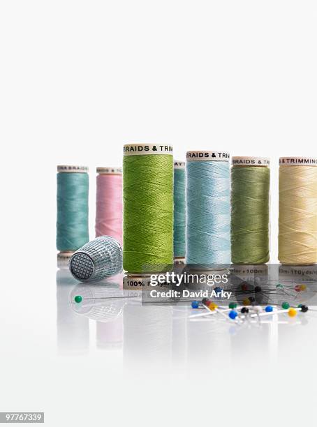 spools of thread and pushpins - thimble stock pictures, royalty-free photos & images