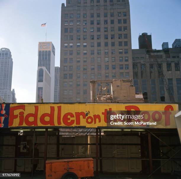 New York City - View of a billboard attached to construction scaffolding on a street in Manhattan.