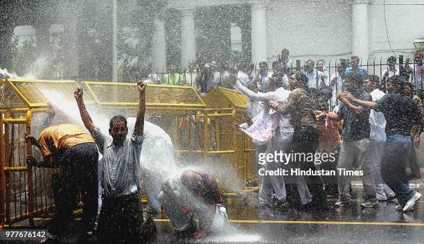 Water cannons are being used on BJP workers who were demonstrating against the steep rise in the prices of petroleum products, at Jantar Mantar on...