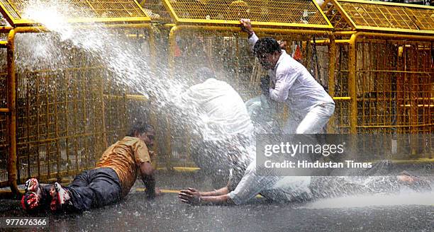 Water cannons are being used on BJP workers who were demonstrating against the steep rise in the prices of petroleum products, at Jantar Mantar on...