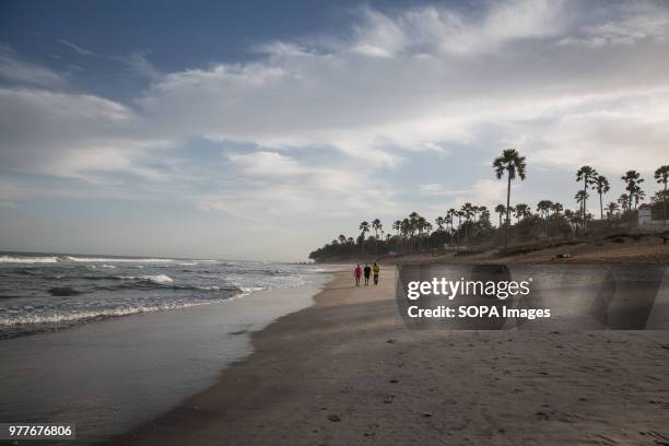 Beach in Serrekunda, Gambia, where many young men go to run or play football, and locals nicknamed "bumsters" are also known to wait to hassle...