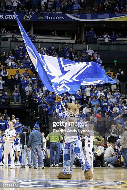 The Wildcat, mascot for the Kentucky Wildcats waves a giant UK flag as he performs against the Mississippi State Bulldogs during the final of the SEC...