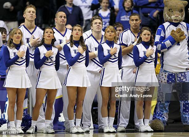 Cheerleaders for the Kentucky Wildcats stand for the performance of the National Anthem against the Mississippi State Bulldogs during the final of...
