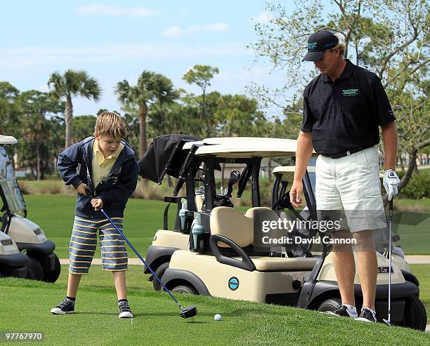 Ernie Els of South Africa with his son Ben during the Els for Autism Pro-Am on the Champions Course at the PGA National Golf Club on March 15, 2010...