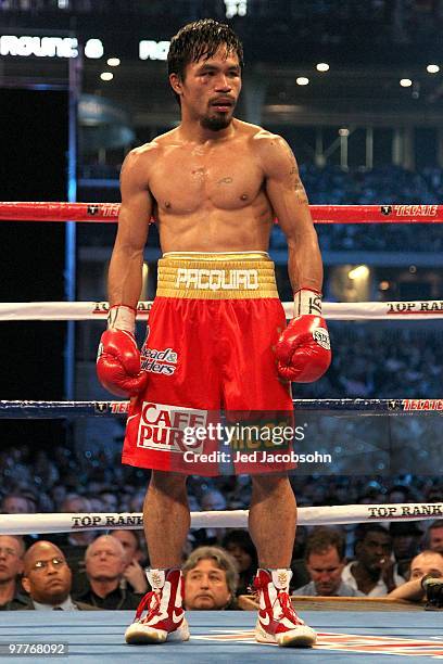 Manny Pacquiao of the Philippines looks on in the ring against Joshua Clottey of Ghana during the WBO welterweight title fight at Cowboys Stadium on...