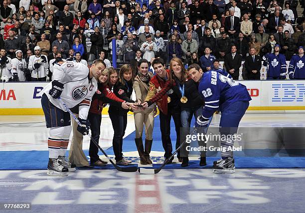 Olympians Tessa Bonhomme, Jayna Hefford, Tessa Virtue, Scott Moir, Becky Kellar and Heather Moyse drop the puck for Ethan Moreau of the Edmonton...