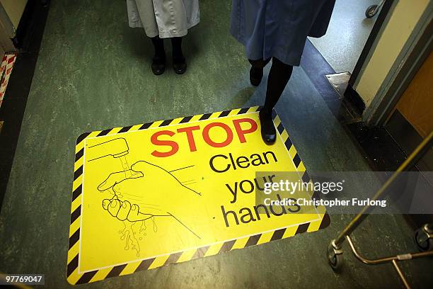 Warning signs alert staff and visitors to wash their hands at The Queen Elizabeth Hospital on March 16, 2010 in Birmingham, England. As the UK gears...