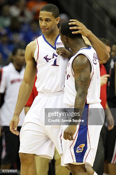 Xavier Henry and Sherron Collins of the Kansas Jayhawks react in the second half while taking on the Texas Tech Red Raiders during the quarterfinals...