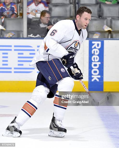 Ryan Whitney the Edmonton Oilers skates up the ice during warmup before game action against the Toronto Maple Leafs March 13, 2010 at the Air Canada...