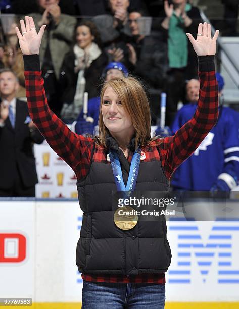 Olympian Heather Moyse waves during a pre-game ceremony before game action between the Toronto Maple Leafs and Edmonton Oilers March 13, 2010 at the...
