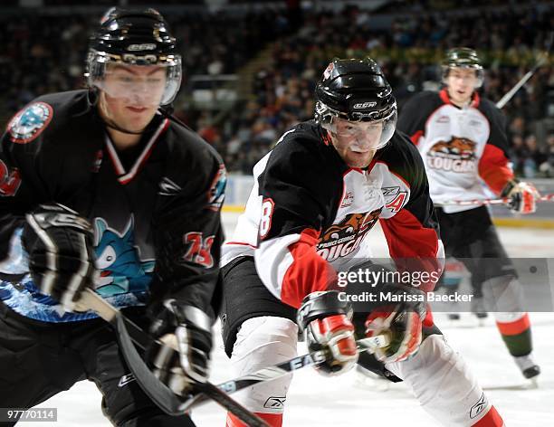 Dallas Jackson of the Kelowna Rockets is checked by Brett Connolly of the Prince George Cougars at the Kelowna Rockets at Prospera Place on March 13,...