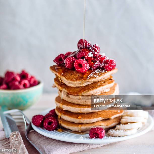 stack of raspberry and maple syrup pancakes - maple syrup pancakes stock pictures, royalty-free photos & images