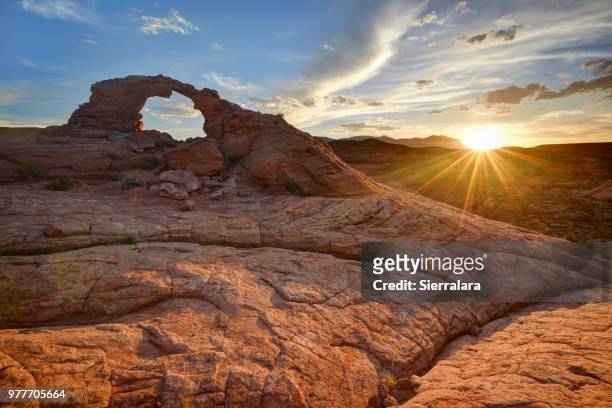 sunset over arsenic arch, san rafael desert near hanksville, utah, america, usa - san rafael desert stock pictures, royalty-free photos & images