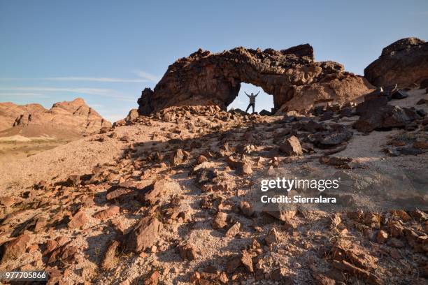 man standing under indian pass wilderness arch, california, america, usa - indian rural people playing with tourists stock-fotos und bilder