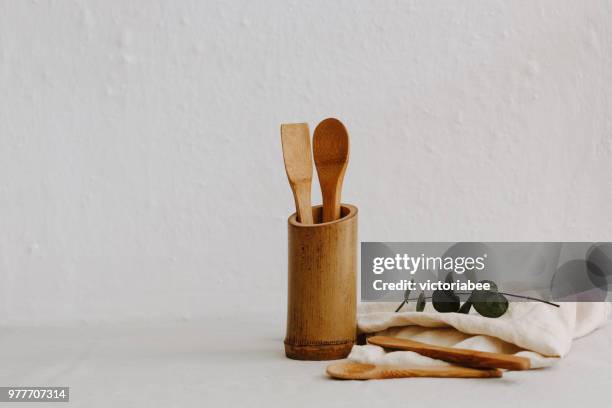 set of wooden kitchen utensils, linen napkin and eucalyptus - kitchen utensils stock pictures, royalty-free photos & images