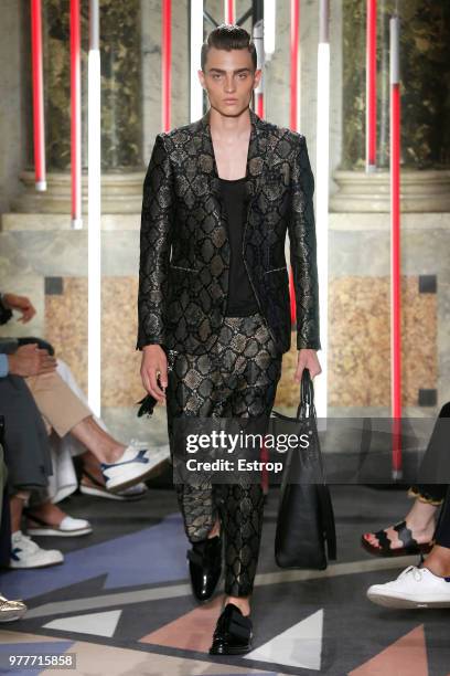 Model walks the runway at the Les Hommes show during Milan Men's Fashion Week Spring/Summer 2019 on June 16, 2018 in Milan, Italy.