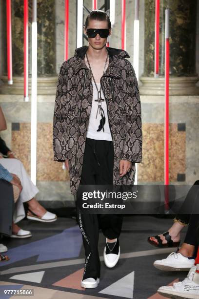 Model walks the runway at the Les Hommes show during Milan Men's Fashion Week Spring/Summer 2019 on June 16, 2018 in Milan, Italy.