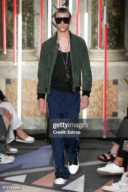 Model walks the runway at the Les Hommes show during Milan Men's Fashion Week Spring/Summer 2019 on June 16, 2018 in Milan, Italy.