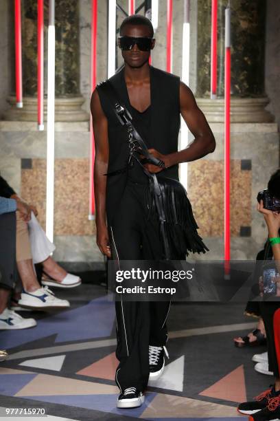 Model walks the runway at the Les Hommes show during Milan Men's Fashion Week Spring/Summer 2019 on June 16, 2018 in Milan, Italy.