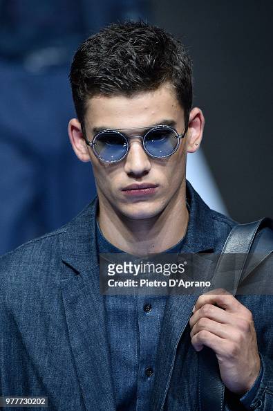 A model walks the runway at the Giorgio Armani show during Milan ...