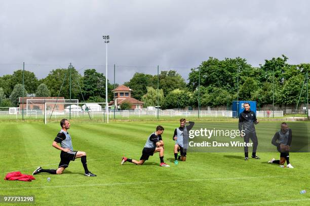 Red Star coach Regis Brouard talks to his players during the first training session of the new season for Red Star on June 18, 2018 in Paris, France.