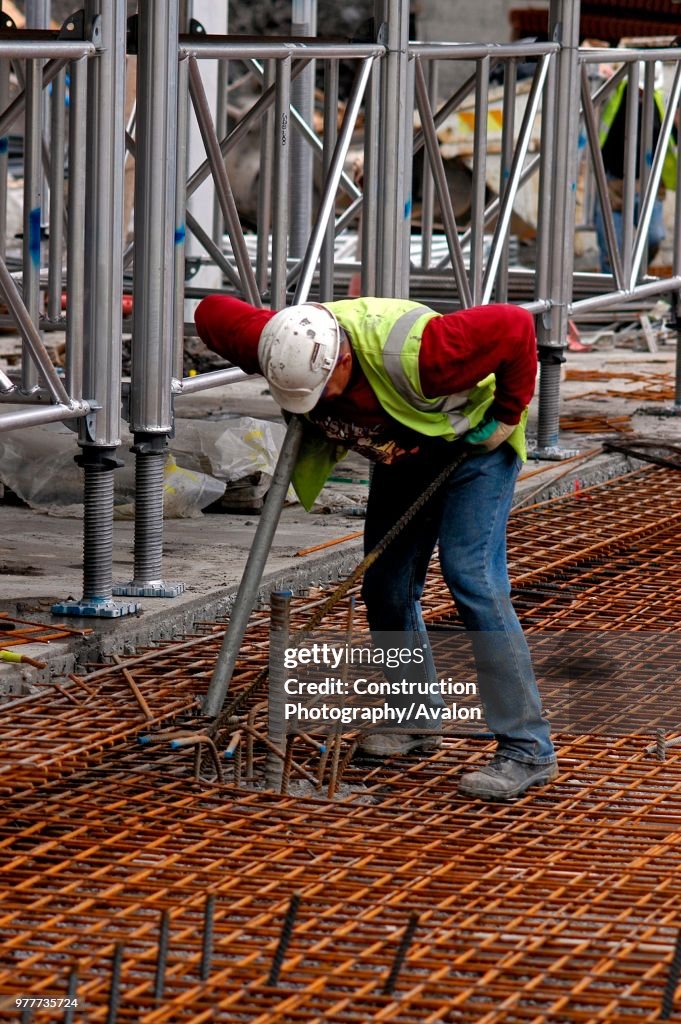 Finishing off laying concrete, Road Construction, London, UK