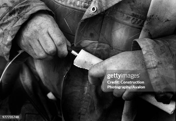 Placing Detonator into Explosive, UK.