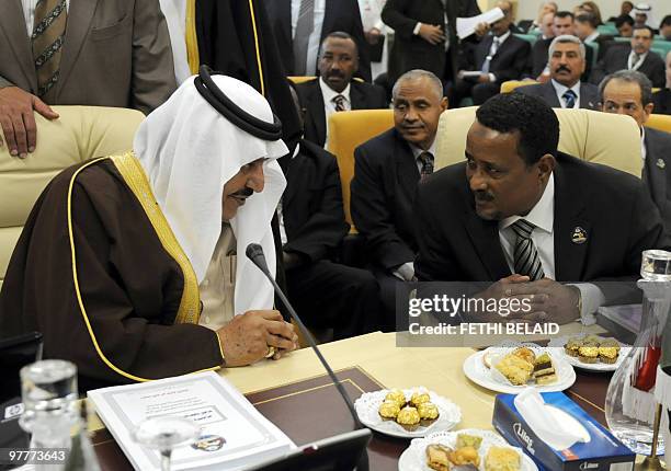 Saudi Interior Minister Prince Nayef Bin Abdul Aziz speaks with Sudanese counterpart Ibrahim Mahmoud Hamid during the opening of the 27th Council of...