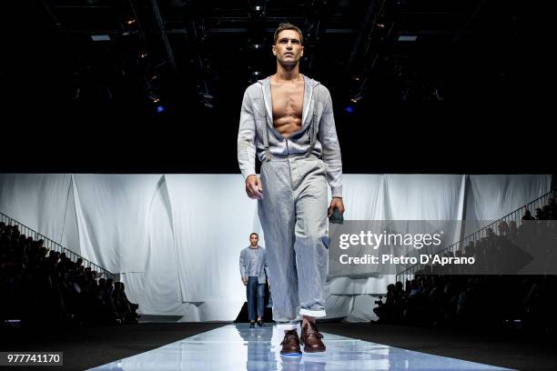 The model Fabio Mancini walks the runway at the Giorgio Armani show during Milan Men's Fashion Week Spring/Summer 2019 on June 18, 2018 in Milan,...