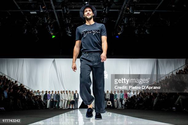 Model walks the runway at the Giorgio Armani show during Milan Men's Fashion Week Spring/Summer 2019 on June 18, 2018 in Milan, Italy.