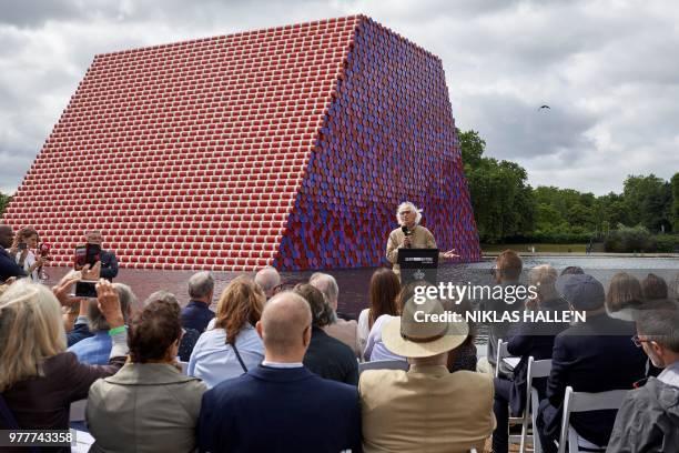 Bulgarian artist Christo Vladimirov Javacheff, better known as 'Christo', speaks as he unveils his artwork, 'The Mastaba' on the Serpentine lake in...