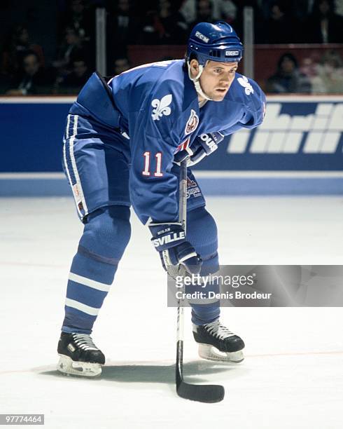 Owen Nolan of the Quebec Nordiques skates against the Montreal Canadiens in the early 1990's at the Montreal Forum in Montreal, Quebec, Canada.