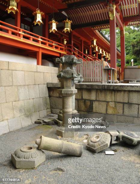 Photo taken on June 18, 2018 shows collapsed lanterns at Iwashimizu Hachimangu shrine in Kyoto following a powerful earthquake that hit Osaka and its...